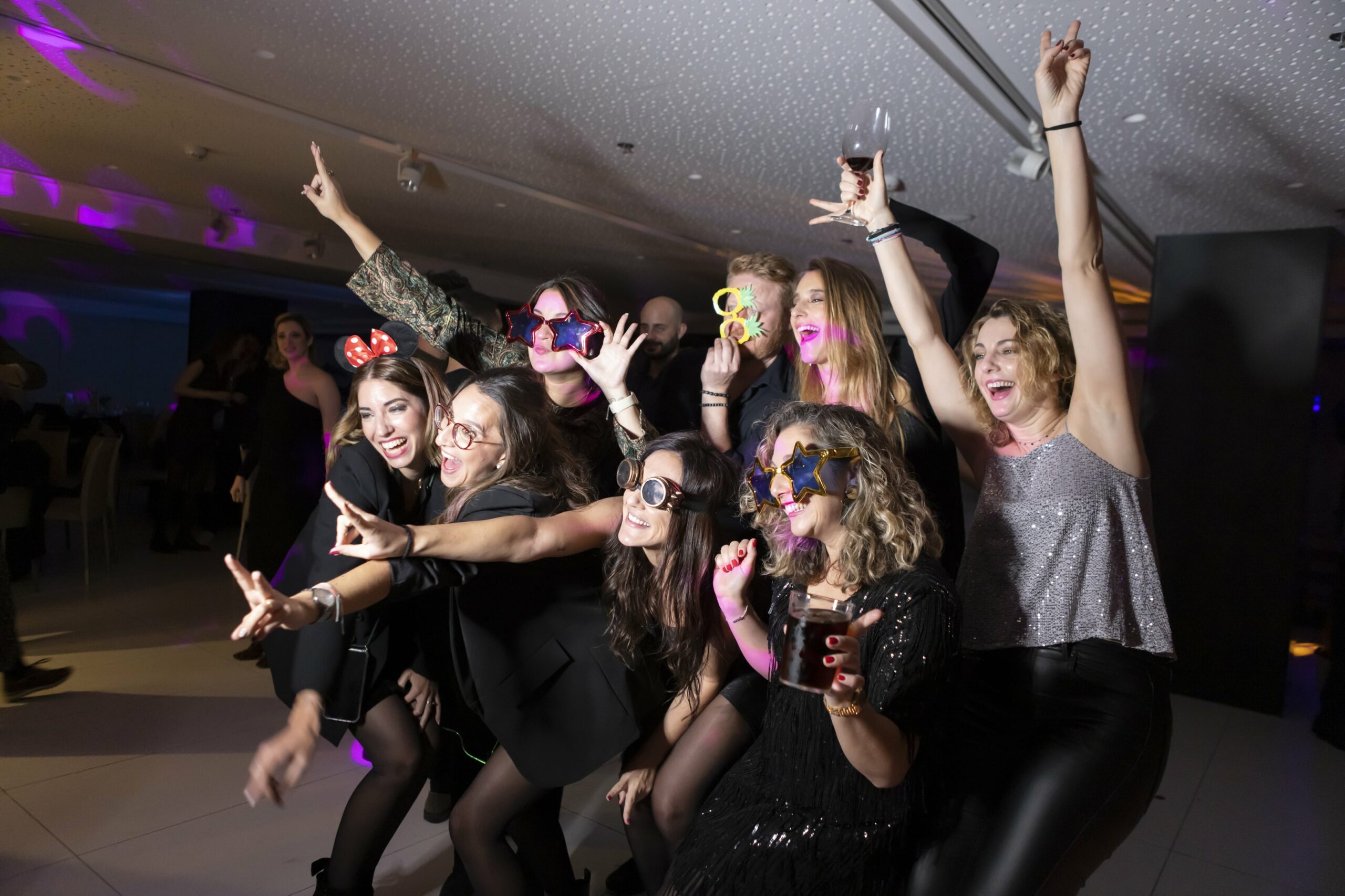 NPAW employees take a picture at the photo booth during the 2022 Christmas dinner and party