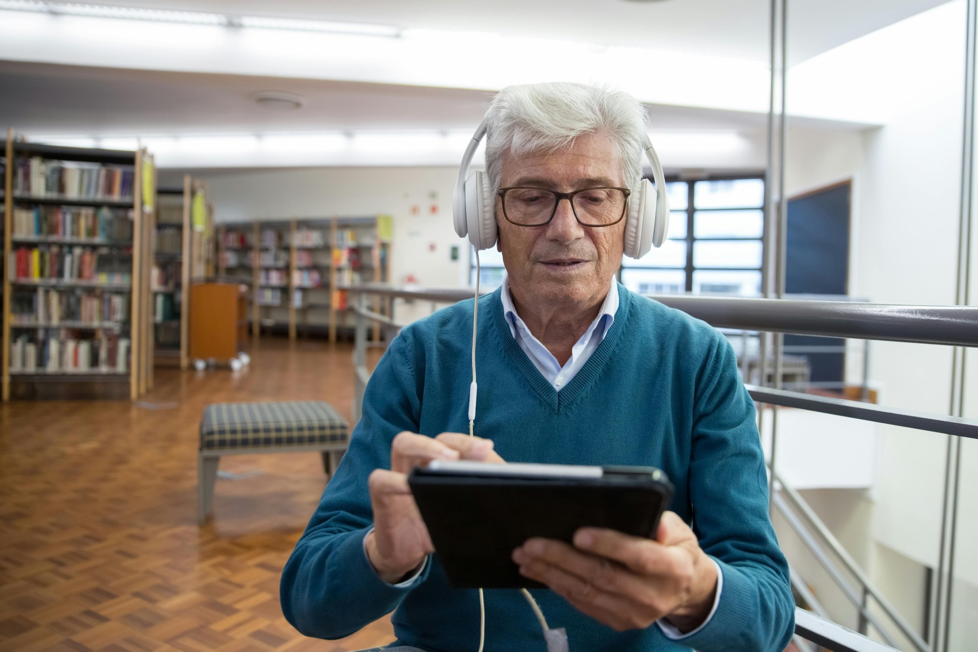 man streaming in library